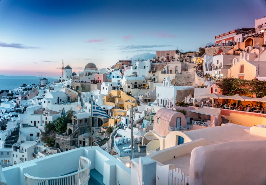 Whitewashed houses of Oia stacked on the Santorini cliffside