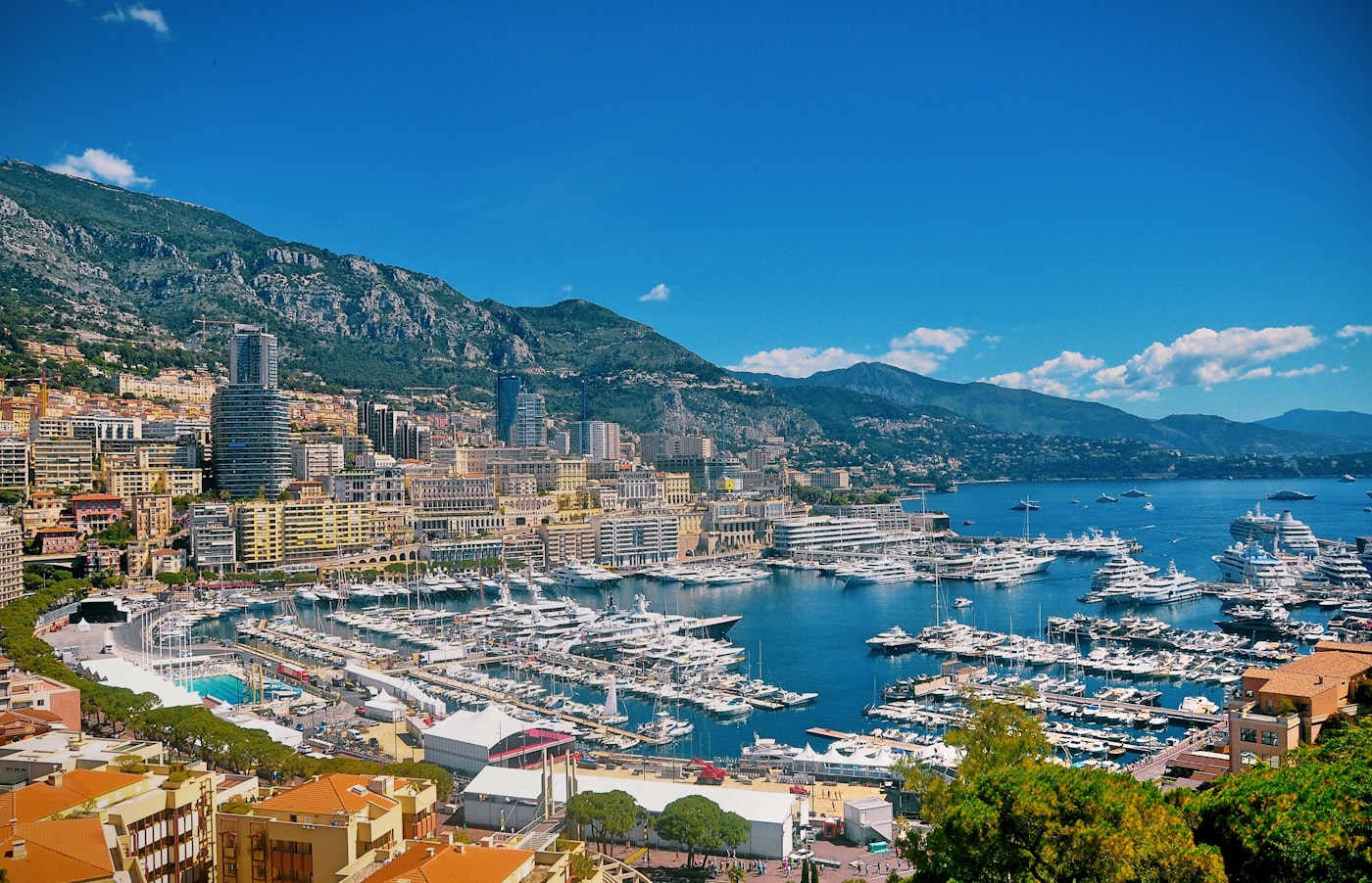 Yachts moored in Monaco's Port Hercule below the town