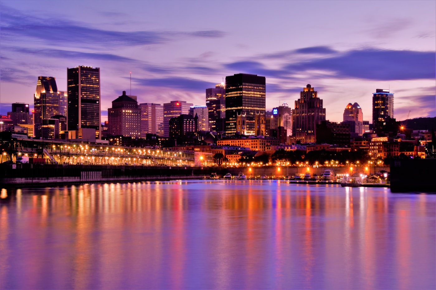 Montréal's Old Port skyline lit up at dusk