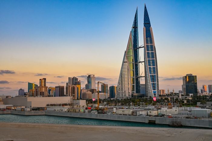 The twin sails of the Bahrain World Trade Center at sunrise